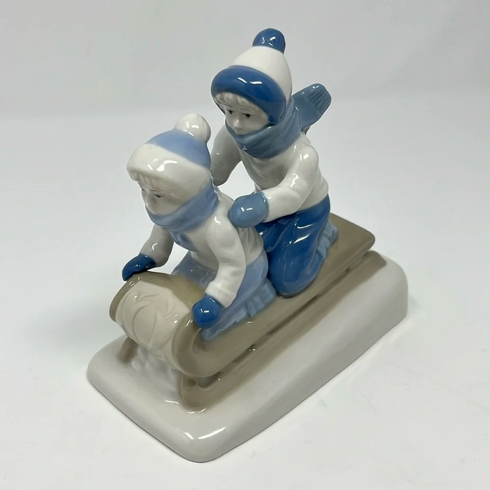 Porcelana De Cuernavaca Mexico Sledding Children Figurine